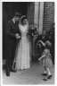 Ken Gurney and Phyllis Best’s wedding, Watford  - Sandra Stuart gives horseshoe while Malcom Stuart looks on from the side - 1945